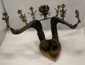 A VINTAGE SET OF TAXIDERMY SET OF HORNS WITH APPLIED INDIAN BRASS INKWELL, DEITIES AND FROG DESIGN