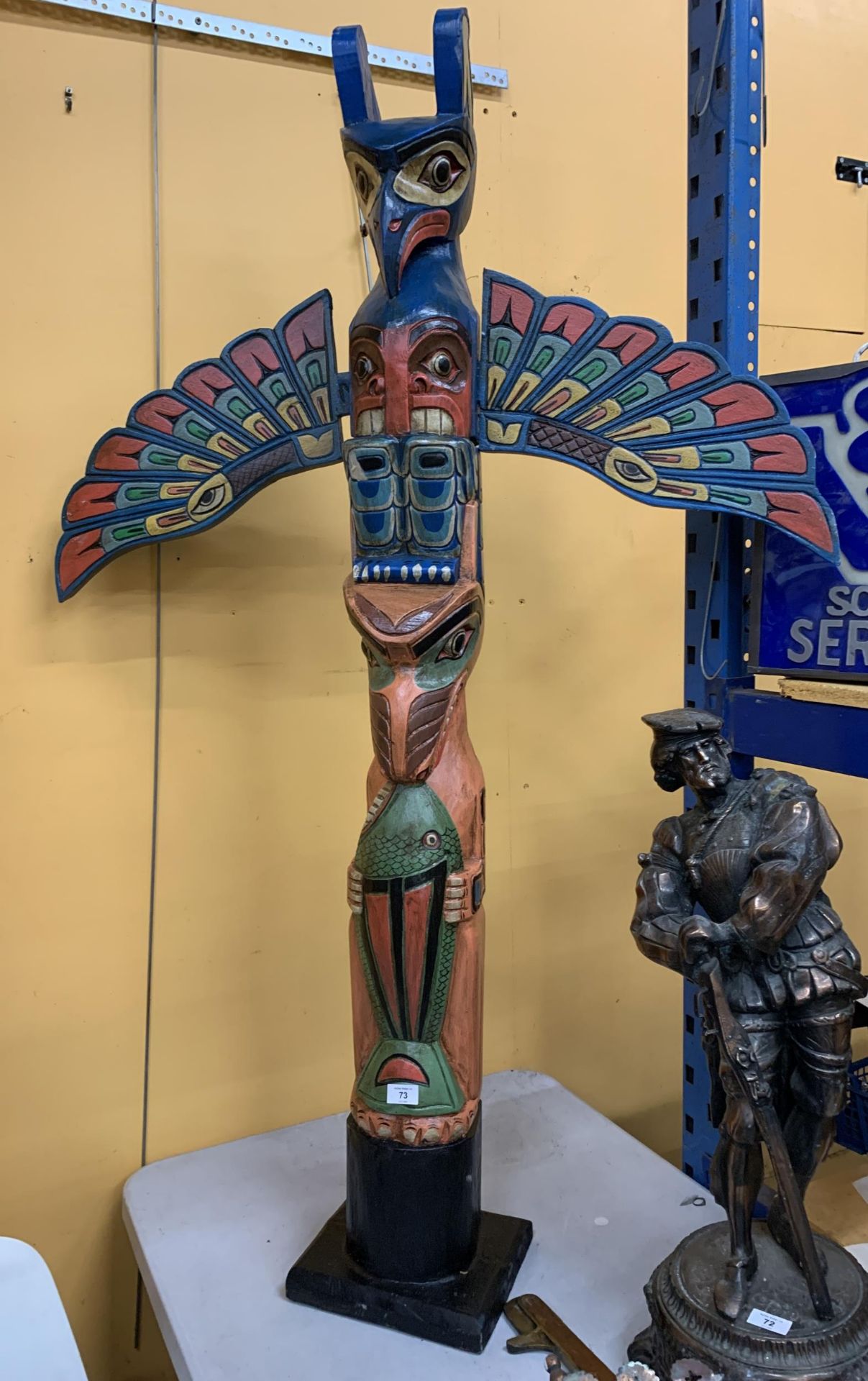 A LARGE WOODEN TOTEM POLE FIGURE