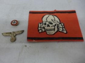 A NAZI GERMANY BADGE, ENAMEL PARTY BADGE AND AN ARM BAND