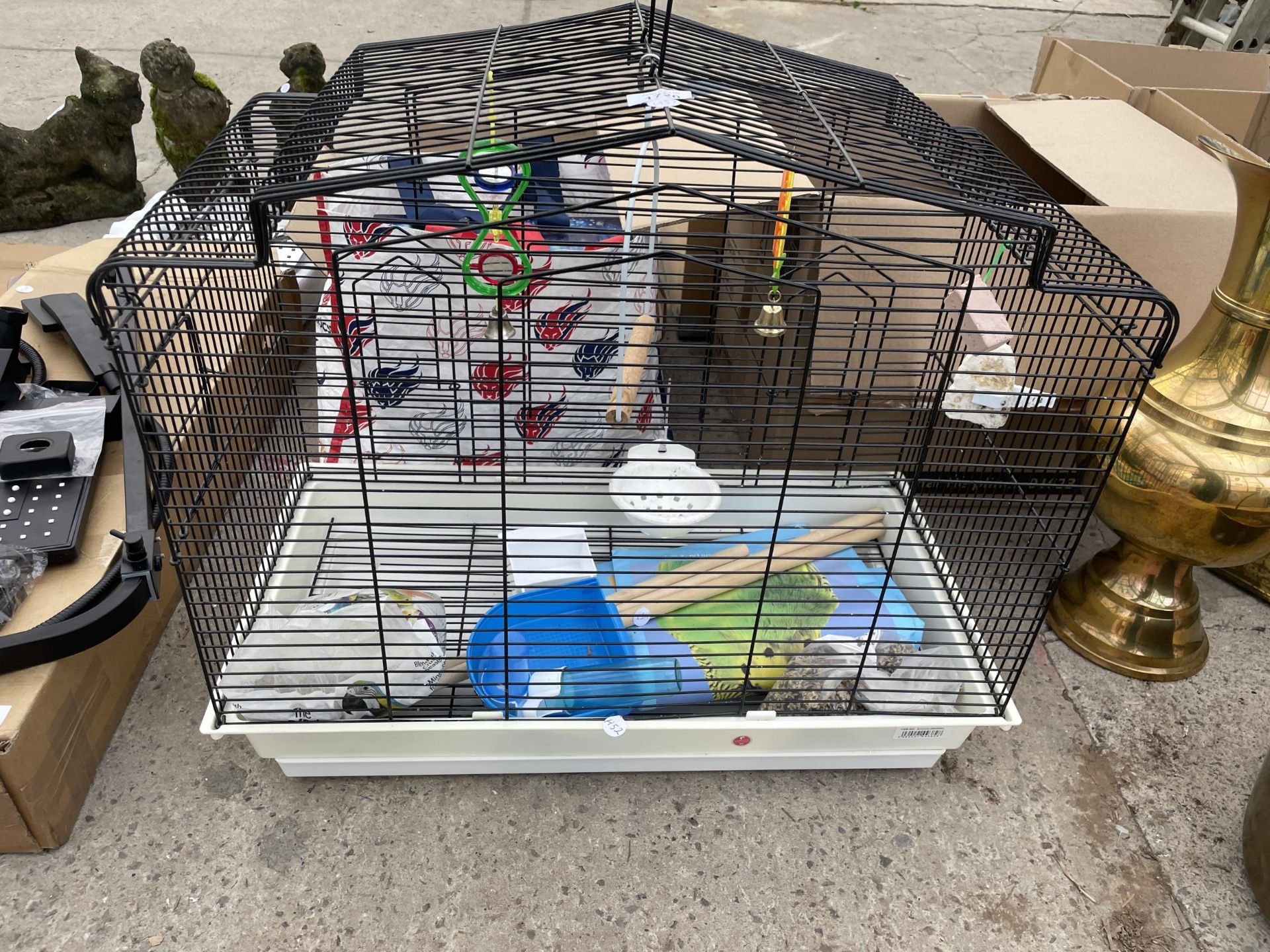 A METAL BUDGIE CAGE AND AN ASSORTMENT OF ACCESSORIES