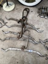 A SET OF FIVE STAINLESS STEEL BUTCHERS ABATOIR HOOKS