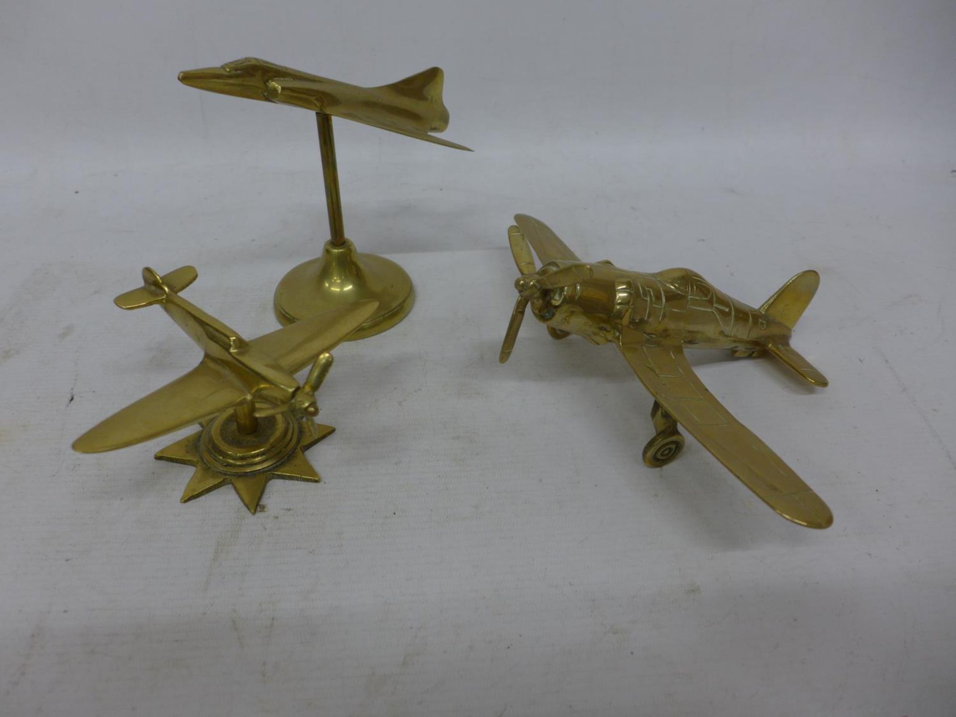 THREE BRASS MODELS OF MILITARY AIRCRAFT