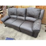 A BROWN FAUX LEATHER THREE DIVISION SETTEE, THE TWO END SECTIONS BEING RECLINERS