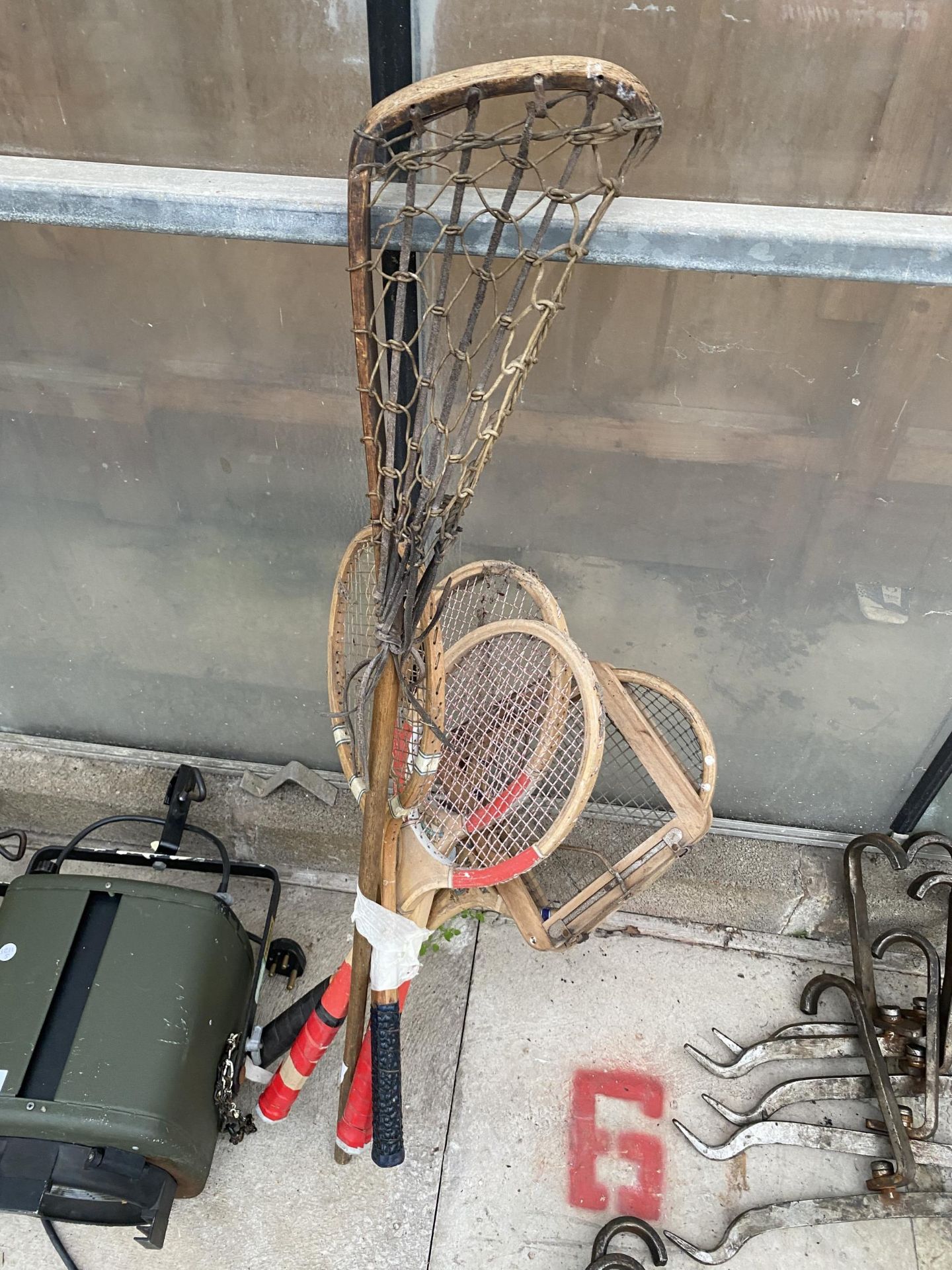 FOUR VINTAGE WOODEN TENNIS RACKETS AND A LACROSS RACKET