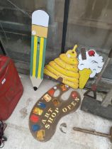 AN ASSORTMENT OF HAND PAINTED WOODEN SIGNS