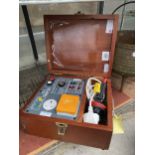 A WOODEN CASED ELECTRICAL SAFETY TESTER