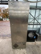 A LARGE STAINLESS STEEL INDUSTRIAL FRIDGE