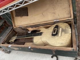 A HAND MADE WOODEN GUITAR WITH CARRY CASE