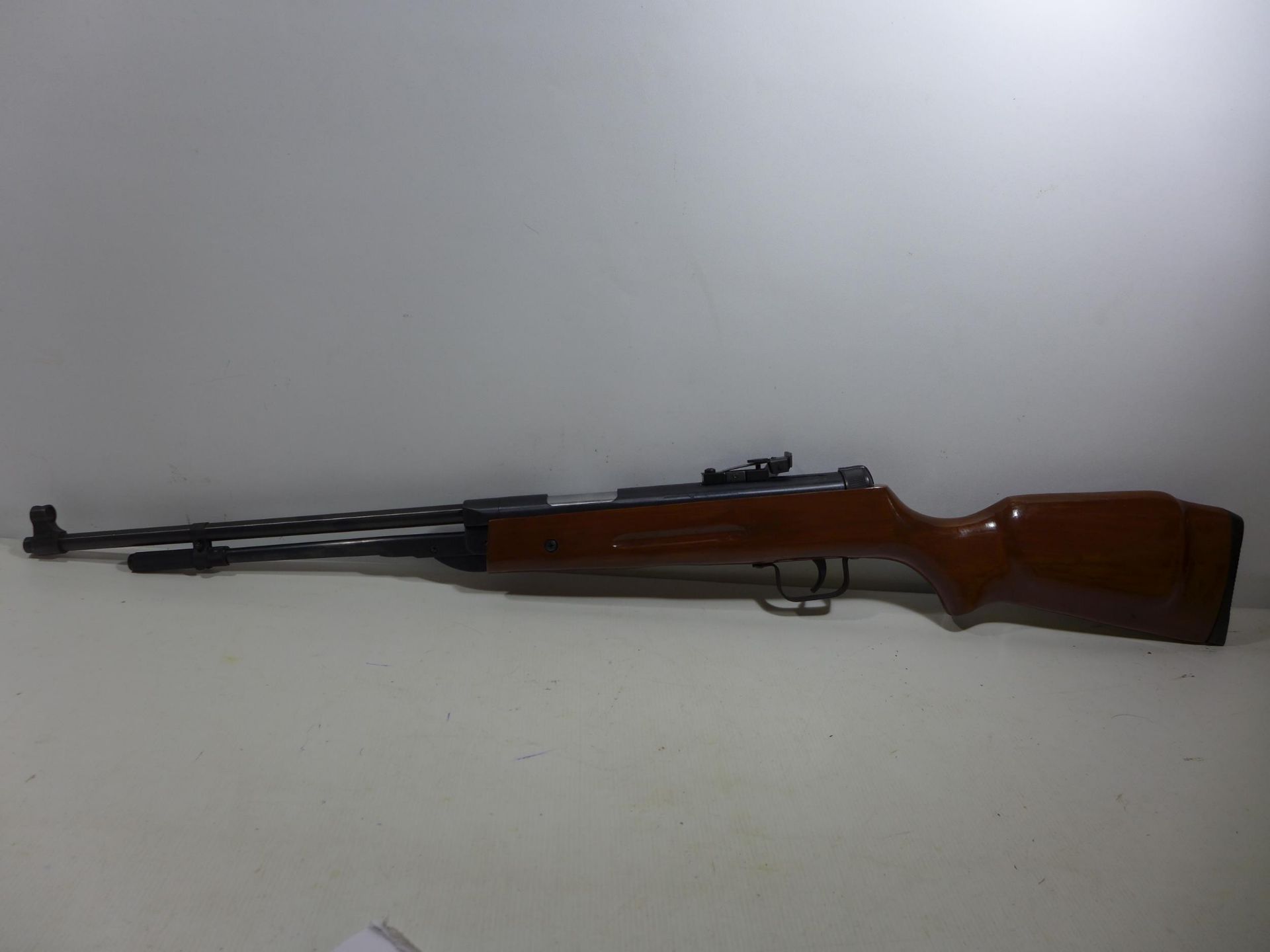 A .22 CALIBRE AIR RIFLE, 44CM BARREL, WOODEN STOCK LENGTH 103CM