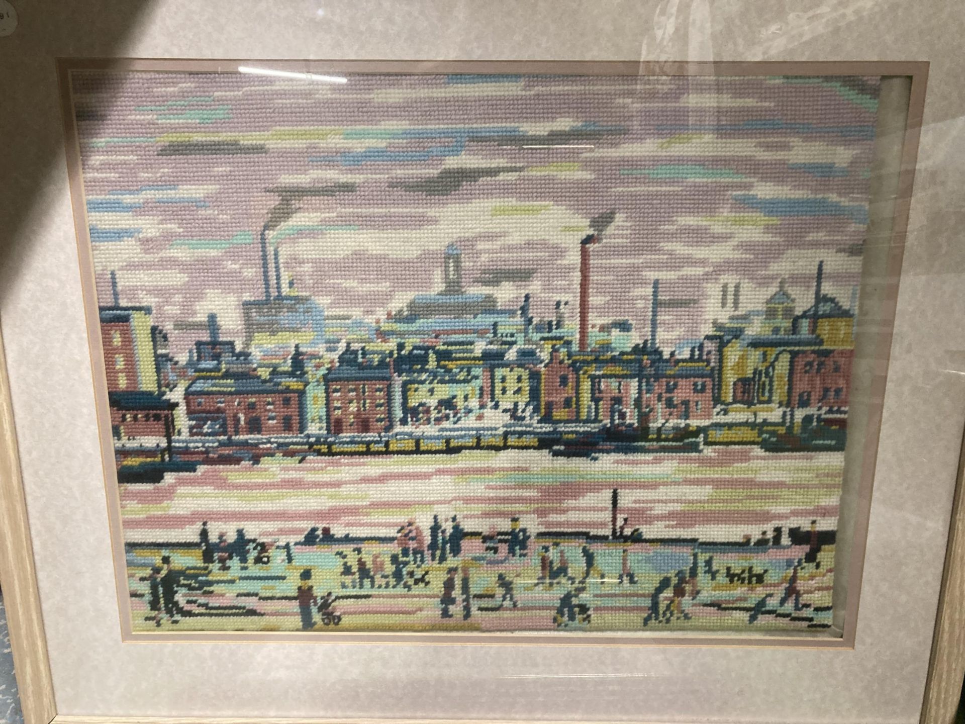 A LOWRY STYLE TAPESTRY FRAMED PICTURE AND FURTHER PRINT - Image 2 of 3