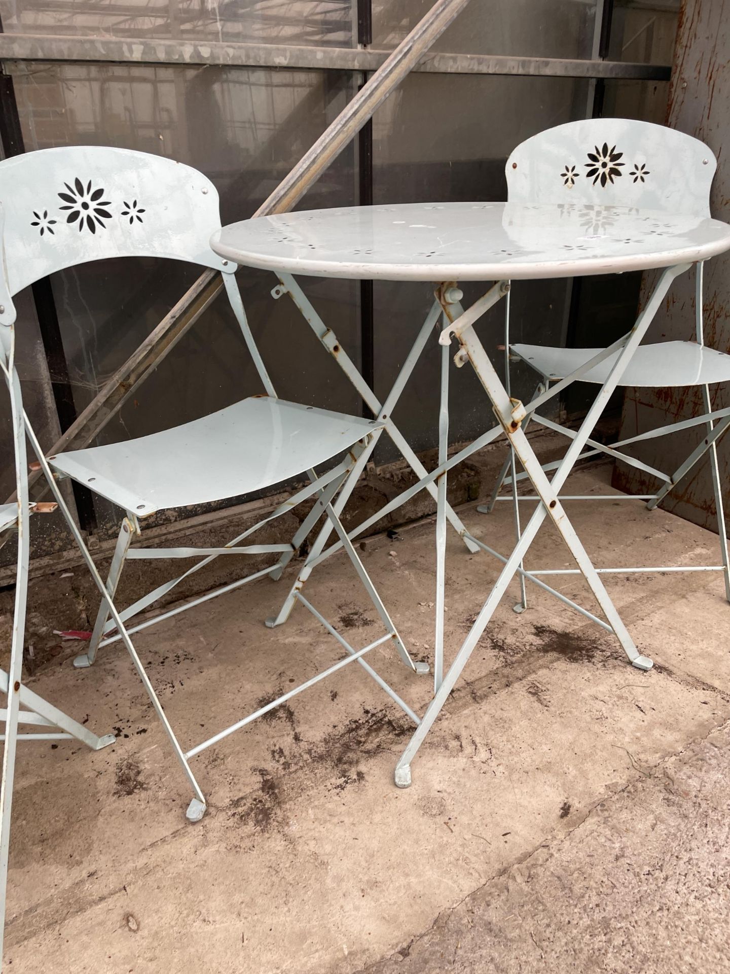 A MODERN METALWARE PAINTED FOLDING PATIO TABLE AND TWO CHAIRS - Image 2 of 2