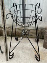 A SMALL METAL PLANT STAND
