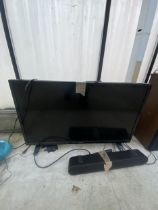 A LUXOR 32" TELEVISION WITH REMOTE CONTROL AND SOUND BAR