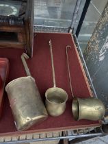 THREE VINTAGE BRASS SPIRIT MEASURING CUPS