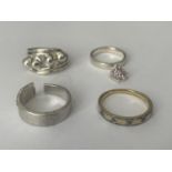 FOUR ASSORTED SILVER RINGS