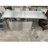 A LOW STAINLESS STEEL KITCHEN WORK UNIT