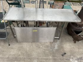 A LOW STAINLESS STEEL KITCHEN WORK UNIT