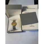 AN OMEGA DE VILLE WRIST WATCH WITH PRESENTATION BOX, OPERATING INSTRUCTIONS AND FURTHER PAPERWORK.