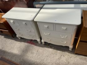 A PAIR OF WHITE PAINTED CHESTS OF TWO SHORT AND TWO LONG DRAWERS, 30" WIDE