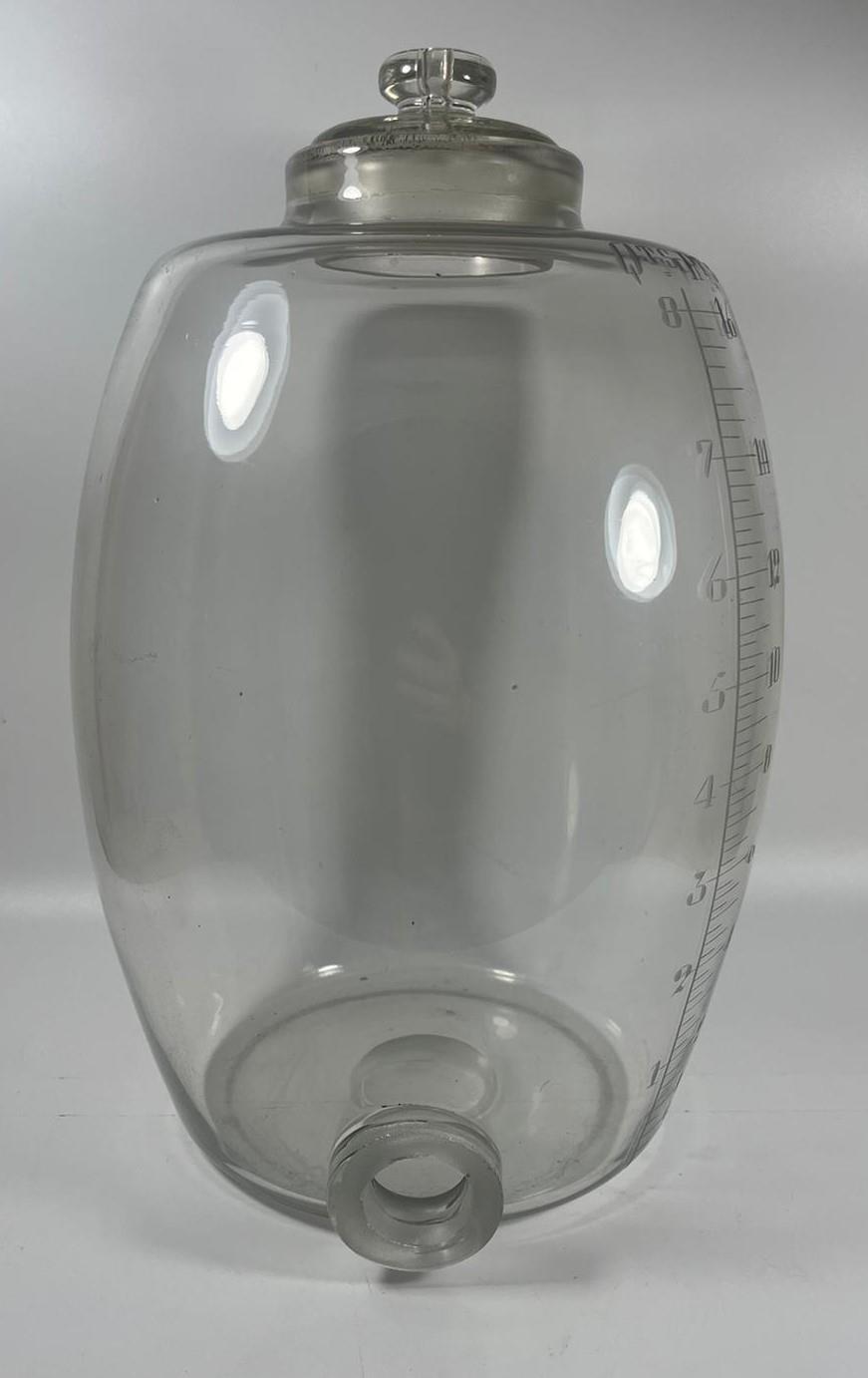 A 19TH CENTURY APOTHECARY / PHARMACY GLASS DISPENSER WITH ETCHED MEASUREMENTS, PONTIL MARK TO