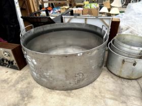 A VERY LARGE STAINLESS STEEL COOKING POT