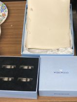 A BOXED WEDGWOOD APOLLO NAPKIN RING SET AND BOXED NOTEBOOK