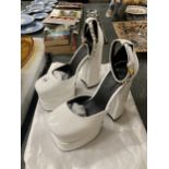A PAIR OF ITALIAN WHITE HIGH HEELED PLATFORM SHOES, MARKED VERSACE WITH DUST BAG - NO PROVENANCE