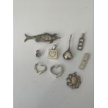 A BAG OF SILVER PENDANTS