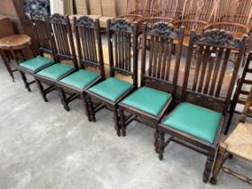 A SET OF SIX OAK EARLY 20TH CENTURY JACOBEAN STYLE DINING CHAIRS, ON TURNED LEGS