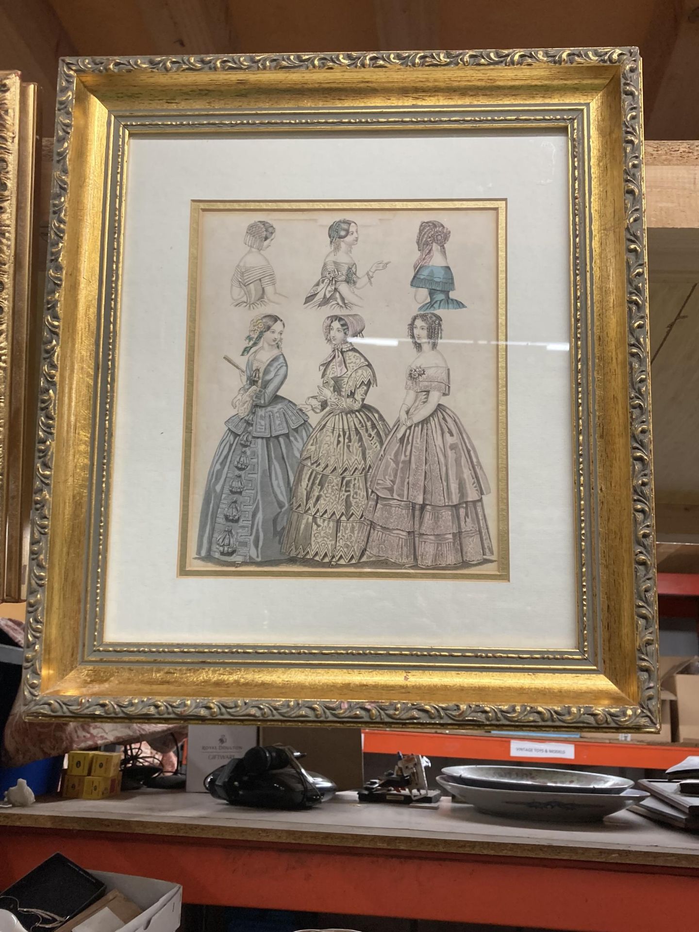 A VINTAGE GILT FRAMED VICTORIAN FASHION PRINT