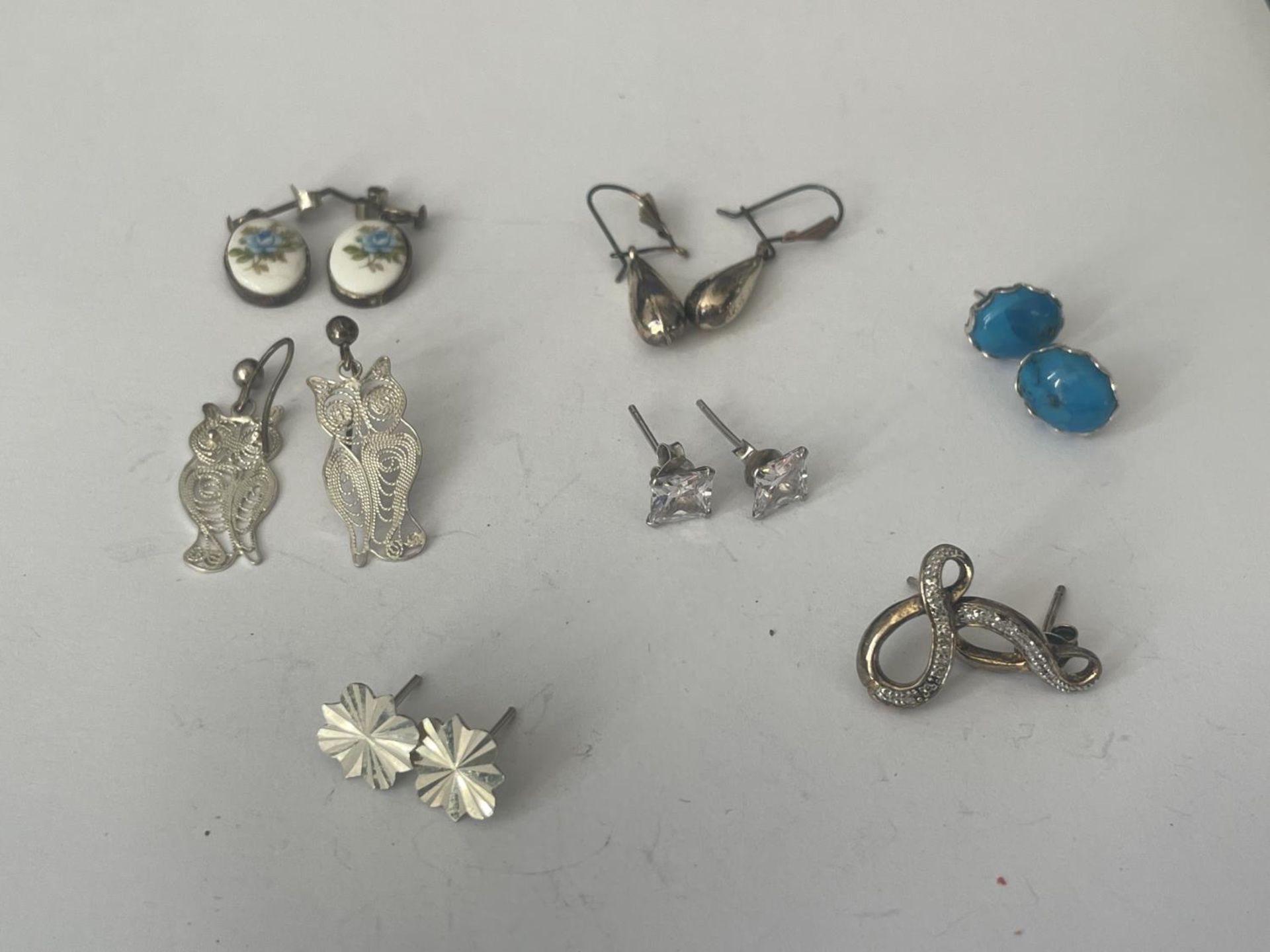 A BAG OF SILVER EARRINGS