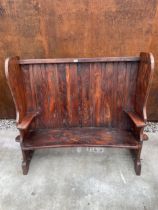 A 19TH CENTURY STYLE ELM TAVEN SETTLE WITH CURVED HIGH BACK, 57" WIDE