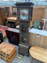 AN OAK CASED DOUBLE WEIGHT LONGCASE CLOCK WITH GLASS DOOR AND BOBBIN TURNED UPRIGHTS