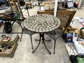 A BISTRO SET COMPRISING OF A ROUND TILE TOP TABLE AND TWO METAL CHAIRS