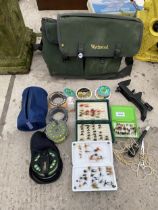 A WYCHWOOD TACKLE BAG AND AN ASSORTMENT OF FISHING TACKLE TO INCLUDE FLIES AND REELS ETC