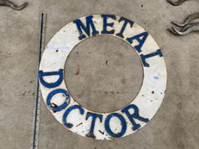 A VINTAGE TIN 'METAL DOCTOR' SIGN