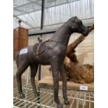 A VINTAGE MINIATURE LEATHER BOUND HORSE