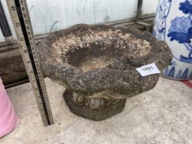 A CONCRETE GARDEN BIRD BATH