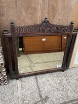 A HEAVILY CARVED OAK VICTORIAN WALL MIRROR, 36 X 32"