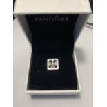 A PANDORA CHARM IN A PRESENTATION BOX