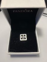 A PANDORA CHARM IN A PRESENTATION BOX