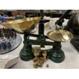 A SET OF VINTAGE GREEN PAINTED LIBRA WEIGHING SCALES WITH BRASS WEIGHTS