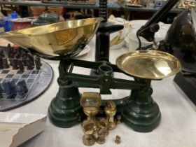 A SET OF VINTAGE GREEN PAINTED LIBRA WEIGHING SCALES WITH BRASS WEIGHTS