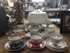 A GROUP ROYAL ALBERT REGAL SERIES CUPS AND SAUCERS TOGETHER WITH REGENCY EXAMPLES