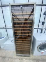 A LARGE CHROME AND BLACK GLASS FRONTED WINE FRIDGE