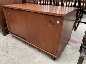 A RETRO TEAK AVALON CABINET WITH TWO SLIDING DOORS, 32" WIDE