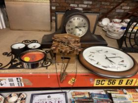 A VINTAGE MAHOGANY NAPOLEON'S HAT MANTLE CLOCK, A CUCKOO CLOCK, A WALL CLOCK WITH BIRD DECORATION