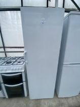 A TALL WHITE INDESIT UPRIGHT FRIDGE