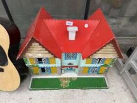 A VINTAGE WOODEN DOLLS HOUSE