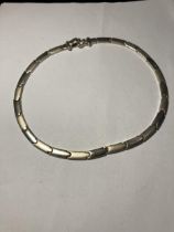 A SILVER NECK CHAIN